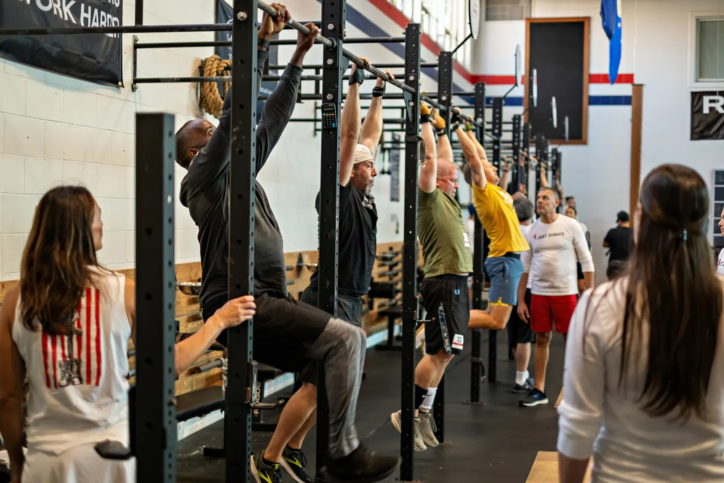 Image of a group of men doing pullups at a Living Donor Games