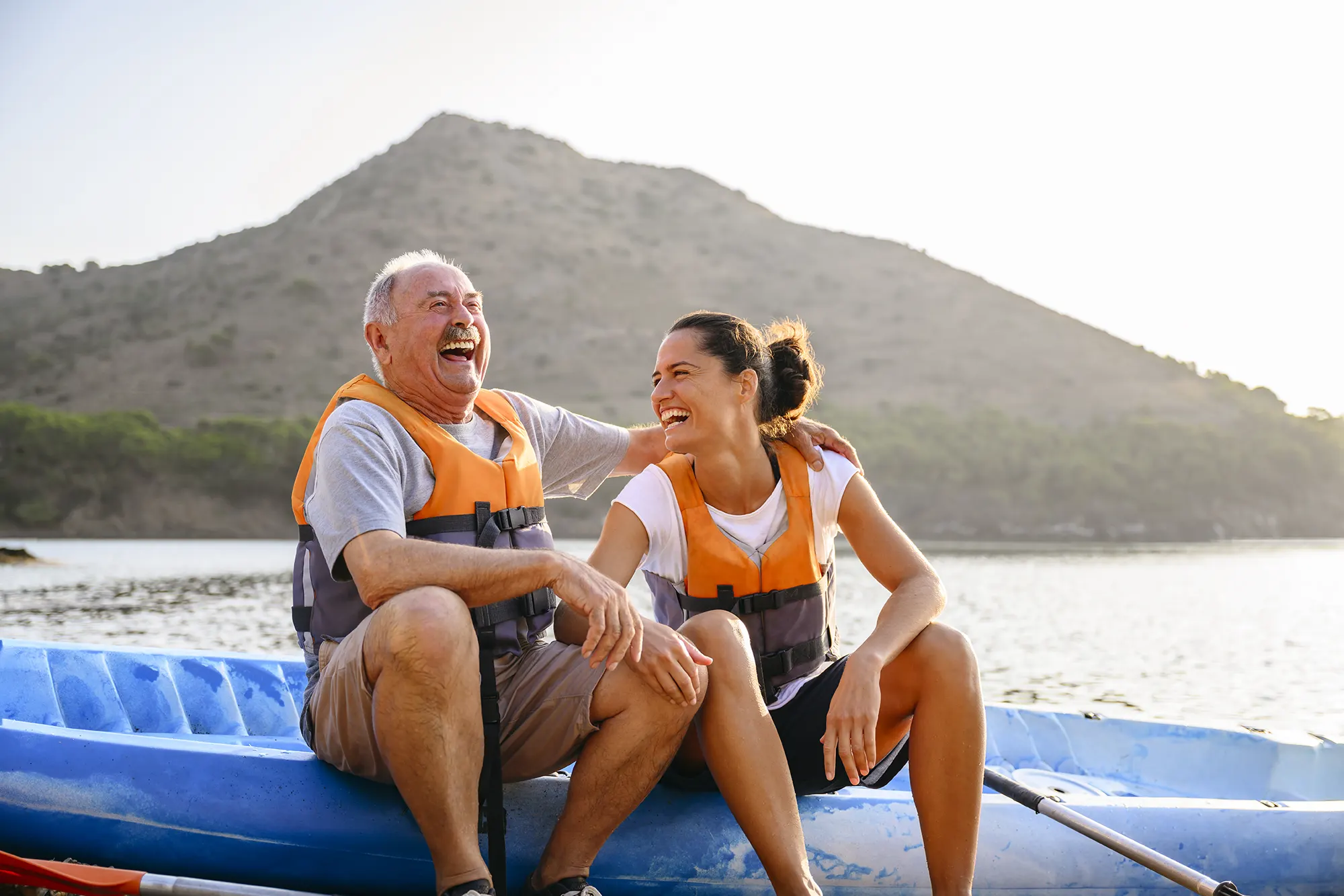 Image of a father and daughter sitting on a kayak